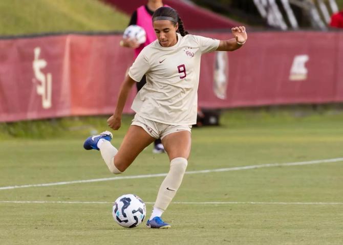 FSU freshman forward Taylor Suarez strikes the ball during a game.