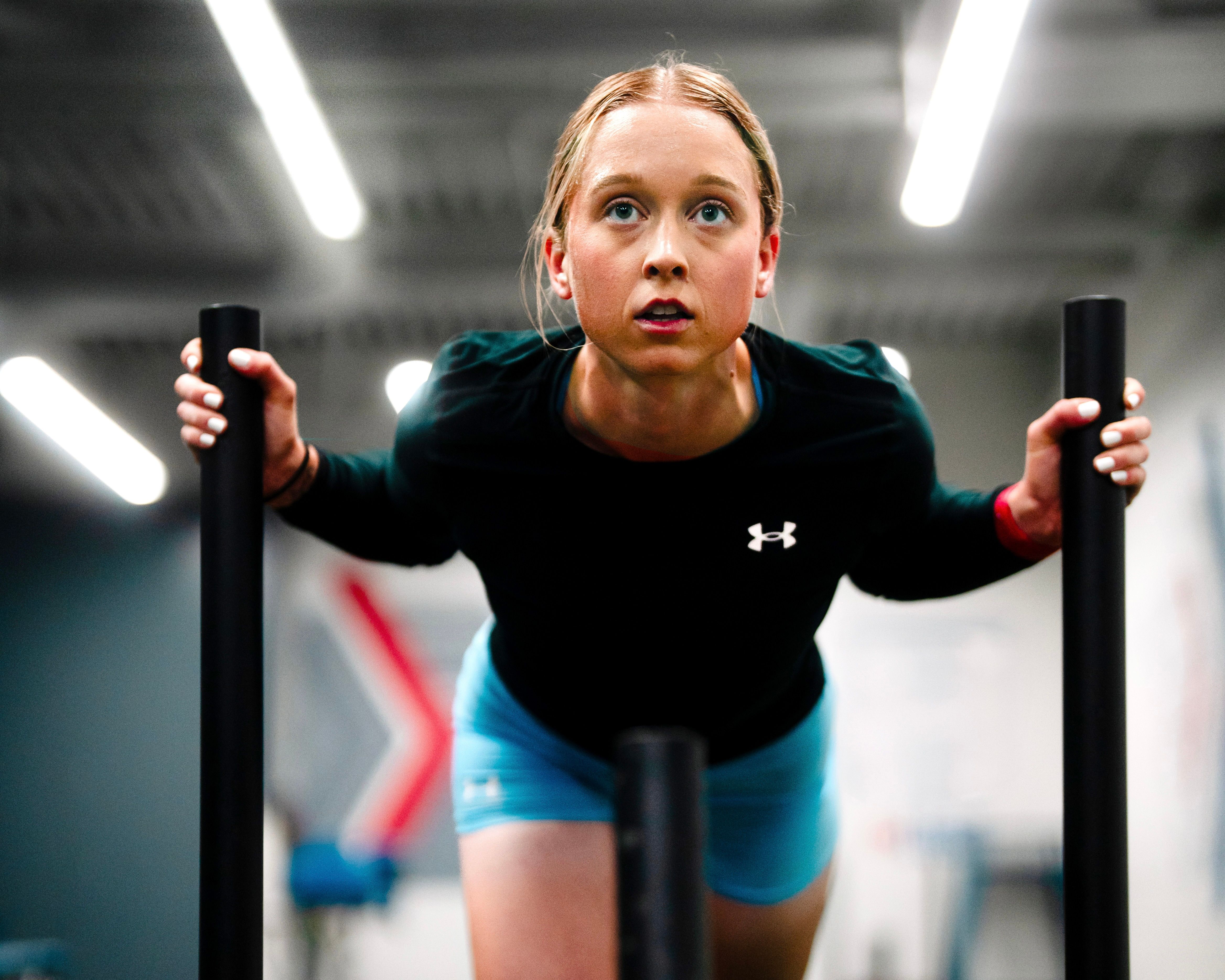 An image of Loren Gabel doing the sled push.