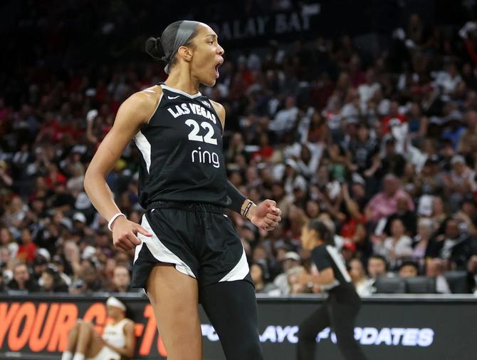 Las Vegas Ace A’ja Wilson flexes after making a big play in Game 5.