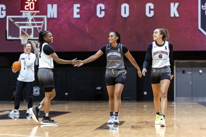Members of the South Carolina women’s basketball team smile at practice.