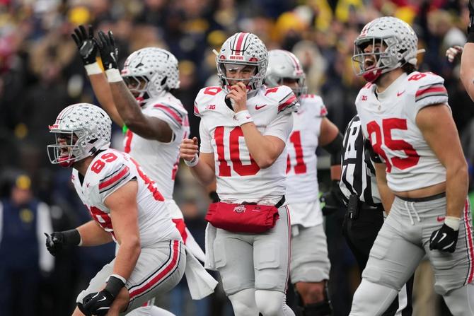 The Ohio State football team celebrates during a game.
