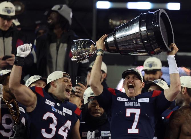 Montreal Alouettes quarterback Cody Fajardo (7) raises the Grey Cup as the Montreal Alouettes beat the Winnipeg Blue Bombers 28-24 in the 110th edition of the Grey Cup at Tim Horton's Field in Hamilton