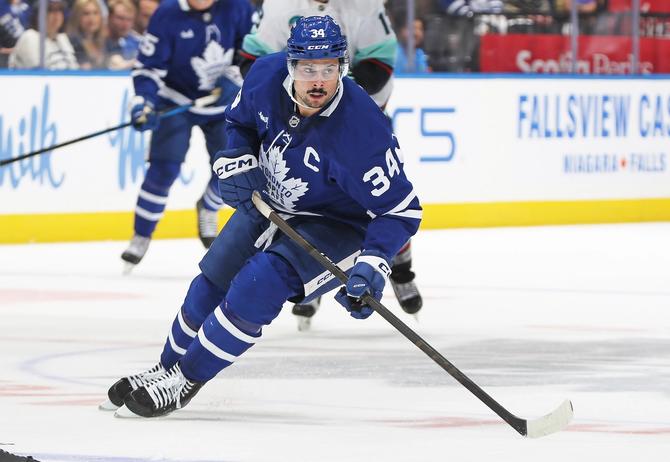 Toronto Maple Leaf Auston Matthews skates up the ice during a game.