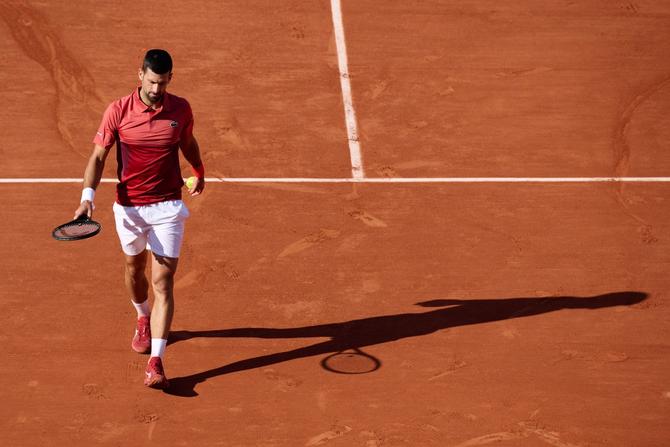 Novak Djokovic reacts during the men's singles fourth round match at the French Open.