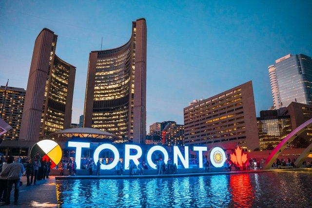 A lit up Toronto sign at Nathan Phillips Square