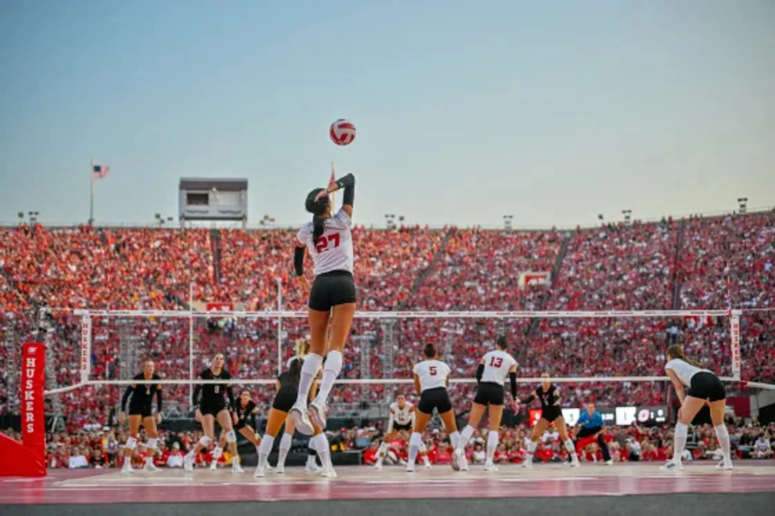 Harper Murray serves during Nebraska’s 2023 volleyball match in the school’s football stadium.