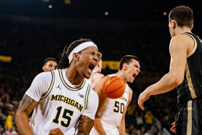 Michigan men’s basketball senior Rubin Jones celebrates during his team’s 75–73 win over Purdue.