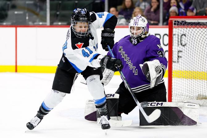 Maddie Rooney #35 of Minnesota defends her net against Brittany Howard #41 of Toronto in the second period in Game Three of the Semi-Finals of the PWHL Playoffs.