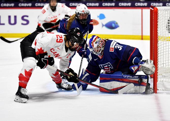 Aerin Frankel #31 of United States makes a pad save on Marie-Philip Poulin #29 of Canada in the third period during the 2024 IIHF Women's World Championship Gold Medal game