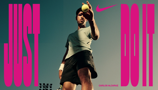 Carlos Alcaraz bouncing a tennis ball with Just Do It around it