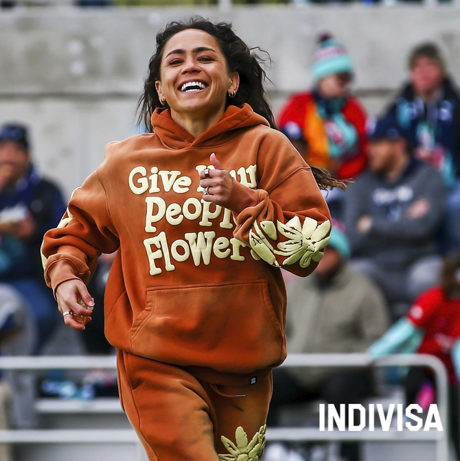 A woman smiling on the pitch