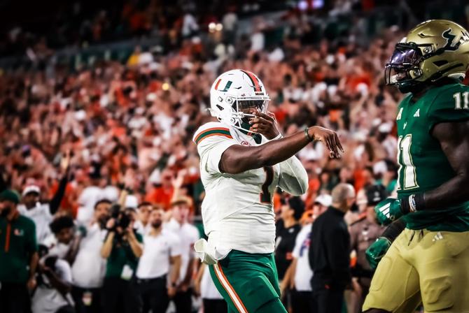 Miami quarterback Cam Ward does his signature celebration.