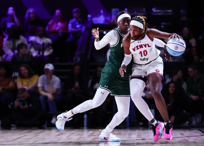 Rhyne Howard #10 of the Vinyl controls the ball around Kahleah Copper #2 of Rose during the second half at The Mediapro Studio on January 17, 2025 in Medley, Florida.
