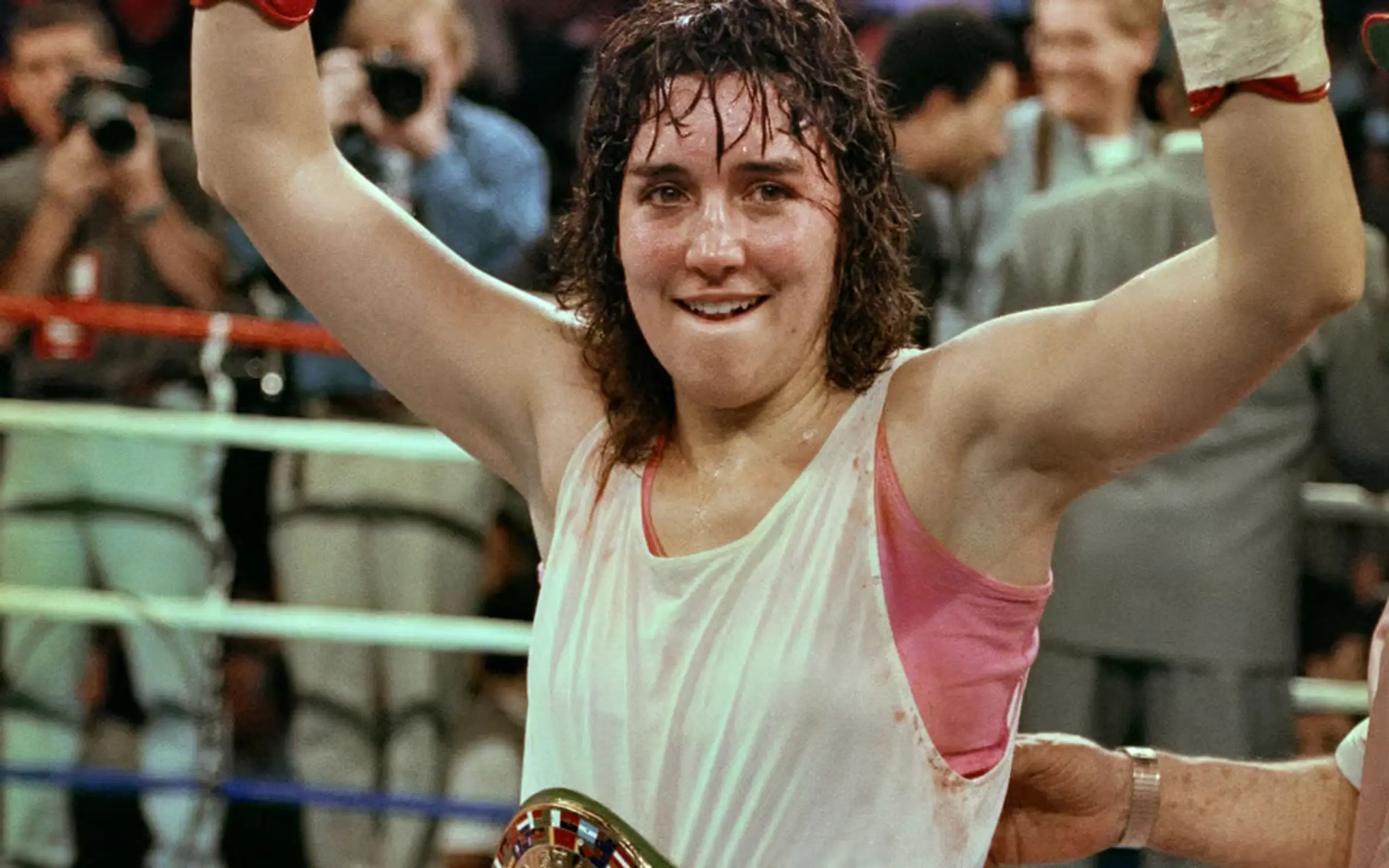 Christy Martin raises her fists in victory after defeating Deirdre Gogarty in 1996.