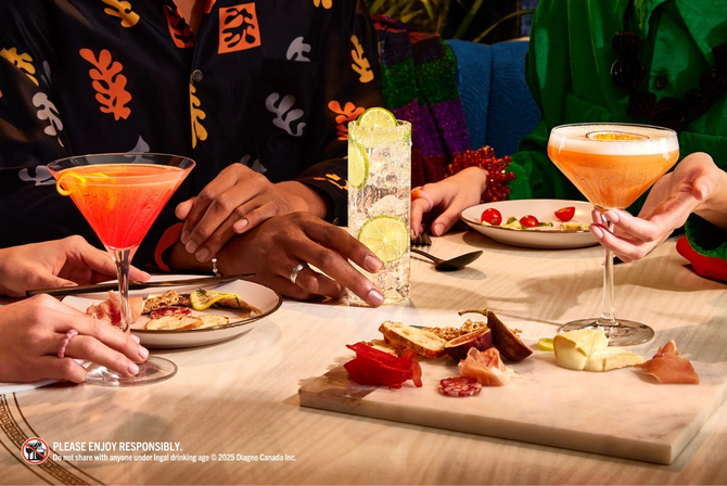 A group of people enjoying cocktails and snacks at a table