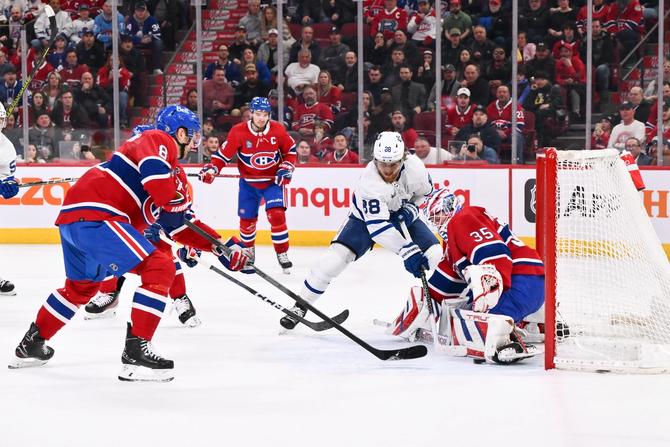 Goaltender Sam Montembeault #35 of the Montreal Canadiens makes a pad save on William Nylander #88 of the Toronto Maple Leafs
