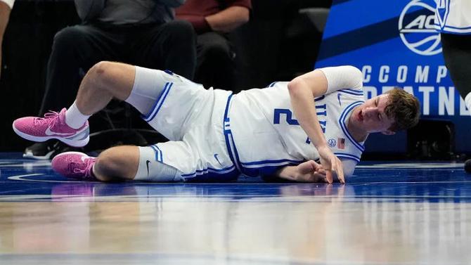 Duke men’s basketball star Cooper Flagg hits the floor after rolling his ankle in the ACC Tournament quarter-finals.