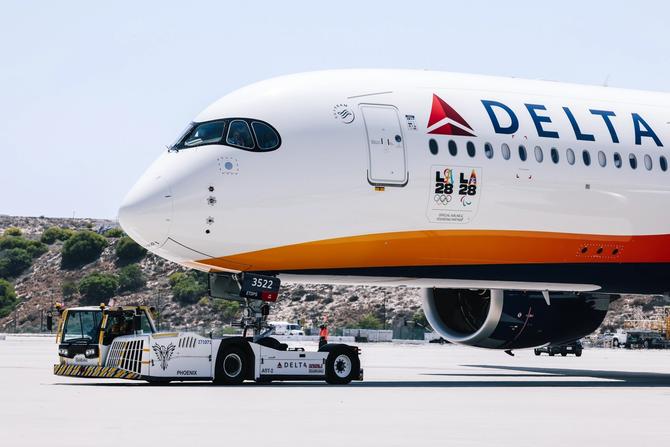 The official Olympic Flag returns to Los Angeles for the first time in 40 years via flight LA28 founding partner Delta Air Lines at LAX airport on Monday, Aug. 12, 2024 in Los Angeles, CA. The LA28 Delta flight includes Team USA athletes; LA28, USOPC and Delta executives; and elected official