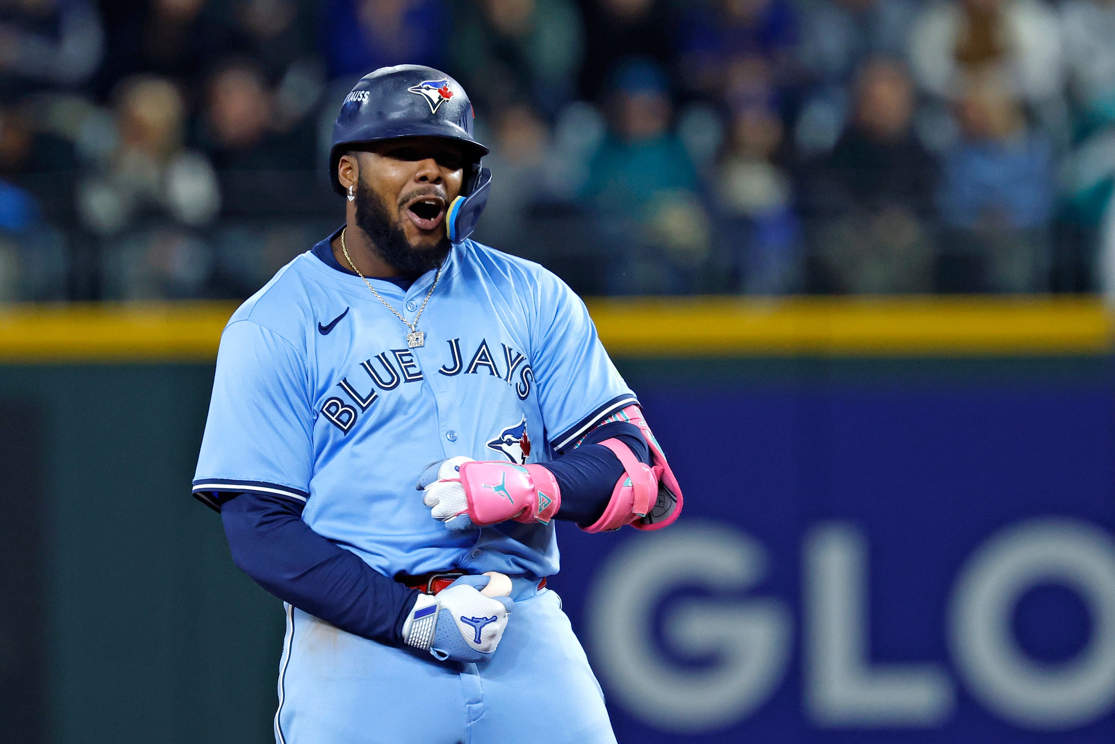 Vladimir Guerrero Jr. #27 of the Toronto Blue Jays celebrates after hitting a double during the eighth inning against the Seattle Mariners in game three of the American League Championship Series