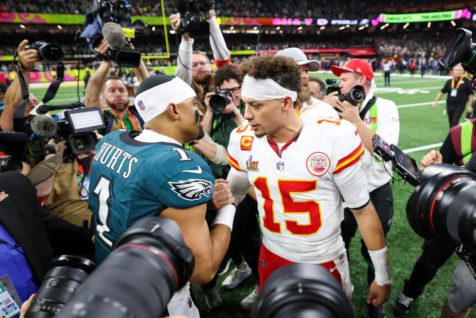 Philadelphia Eagles quarterback Jalen Hurts shakes hands with Kansas City Chiefs quarterback Patrick Mahomes after Super Bowl LIX.