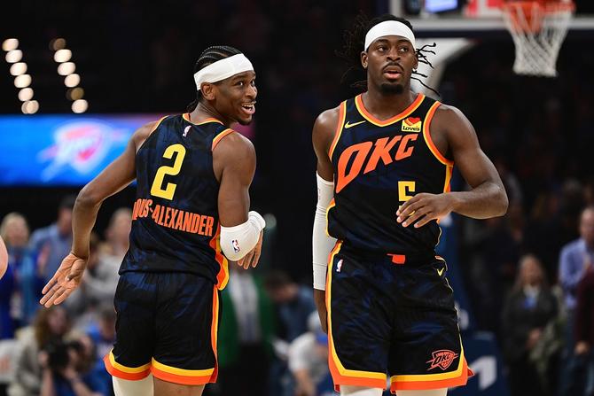 Shai Gilgeous-Alexander #2 and Luguentz Dort #5 of the Oklahoma City Thunder run down the floor during the first half against the Sacramento Kings