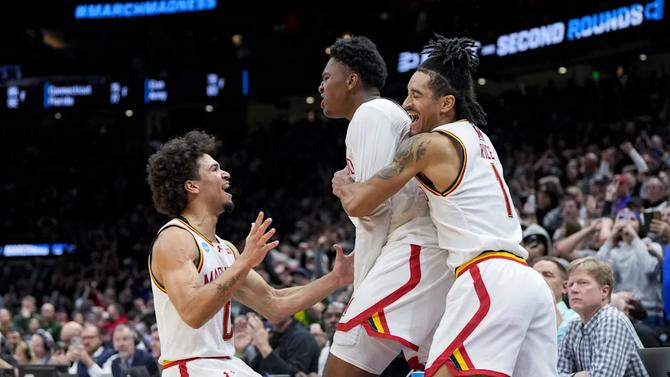 Maryland men’s basketball star Derik Queen celebrates with teammates after scoring the game-winning shot against Colorado State.
