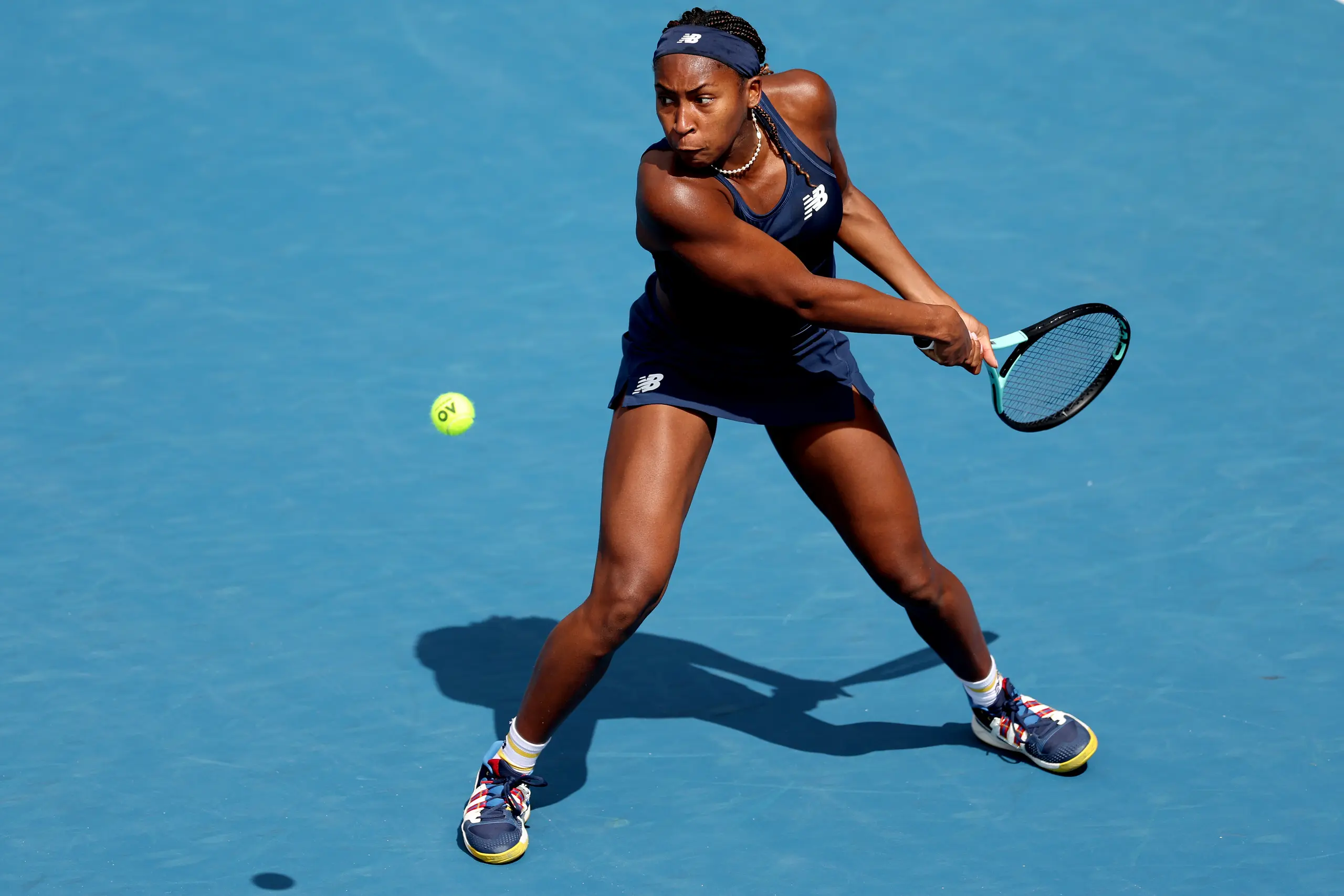 Coco Gauff plays a backhand. 