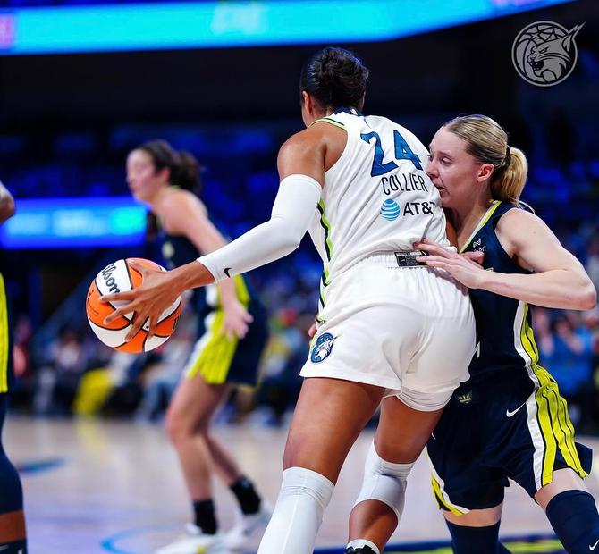 Minnesota Lynx superstar Napheesa Collier backs down Dallas Wing Paige Bueckers during a game.
