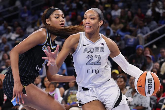 Las Vegas Ace A’ja Wilson drives to the basket against the Chicago Sky’s Angel Reese.