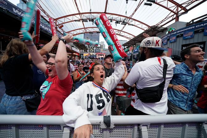 Fans in Kansas City celebrate a goal during an outdoor watch party for the 2023 Women’s World Cup.