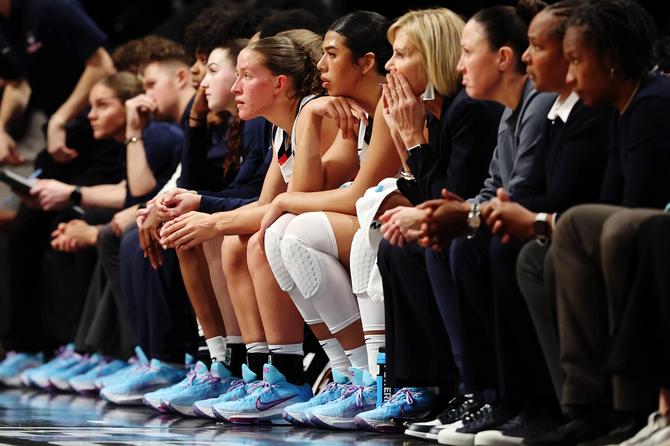 Members of the UConn Huskies wear the Nike G.T. Hustle 3 Paige Bueckers Player Edition sneaker during the first half against the Louisville Cardinals in the Shark Beauty Women's Champions Classic at Barclays Center on December 07, 2024 in the Brooklyn borough of New York City.