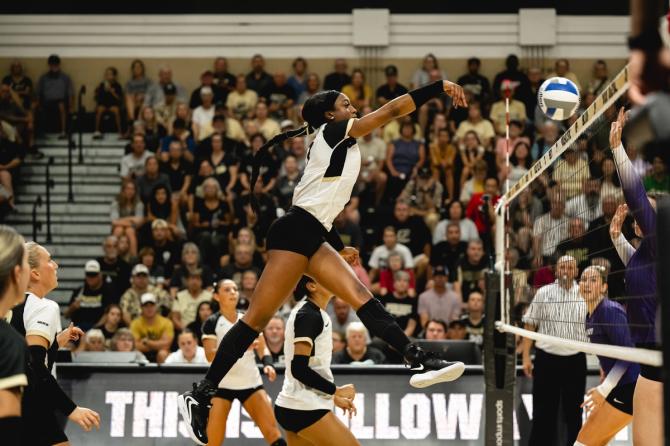 Purdue's Raven Colvin spikes the ball