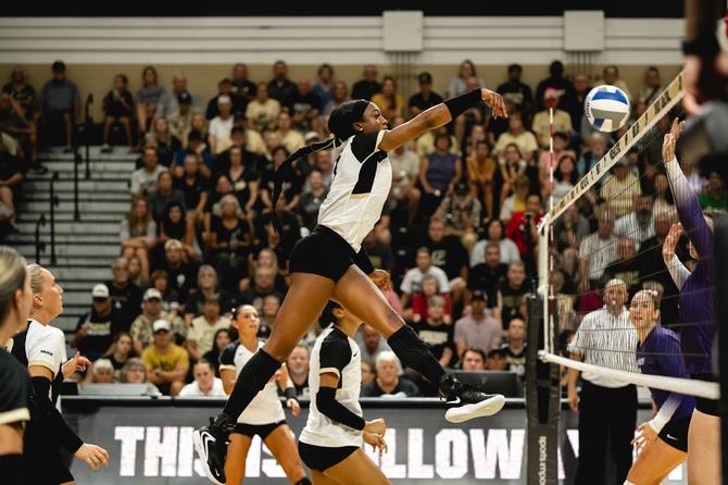 Purdue’s Raven Colvin spikes the ball
