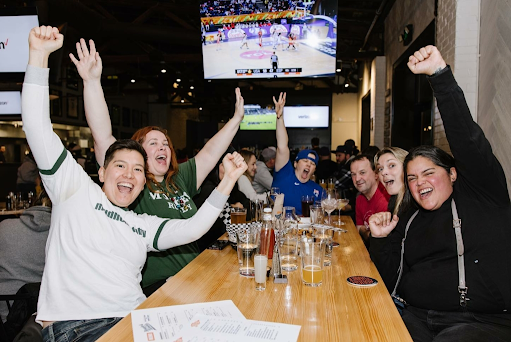 Patrons gather at Rough & Tumble bar in Seattle, Washington.