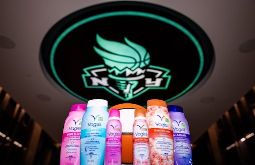 An assortment of Vagisil products sit in front of a WNBA basketball in the New York Liberty locker room.