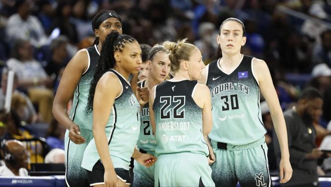 The NY Liberty huddle during a game.