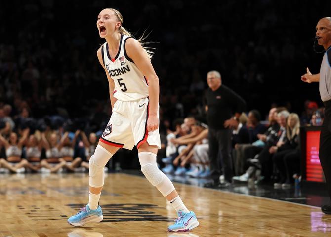 Paige Bueckers #5 of the UConn Huskies reacts while wearing the Nike G.T. Hustle 3 Paige Bueckers Player Edition sneaker.