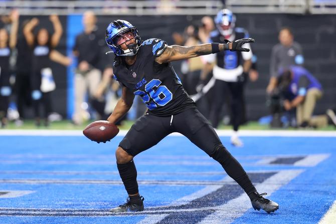 Detroit Lion Jahmyr Gibbs celebrates scoring a touchdown against the Minnesota Vikings.