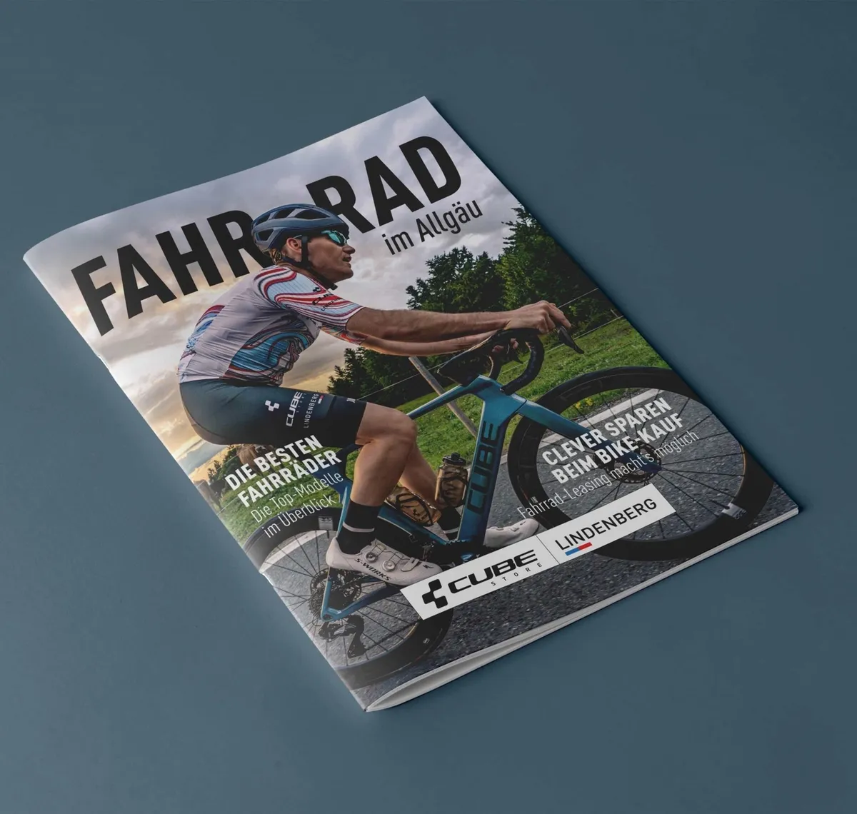 CUBE Store Lindenberg: Broschüre „Fahrrad im Allgäu" von CUBE Lindenberg mit einem Rennradfahrer auf dem Titel