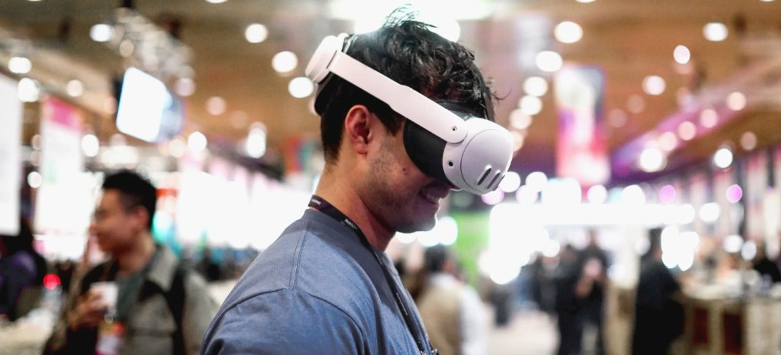 Visitor wearing a VR headset during an artificial intelligence and innovation event at AIS26, the AI in Science Summit 2026.