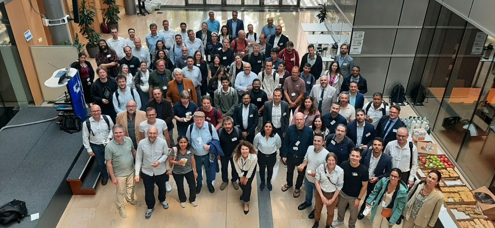 Participants attending the FM4Science and HFMI workshop in Brussels, discussing scientific foundation models and AI-driven research collaboration.