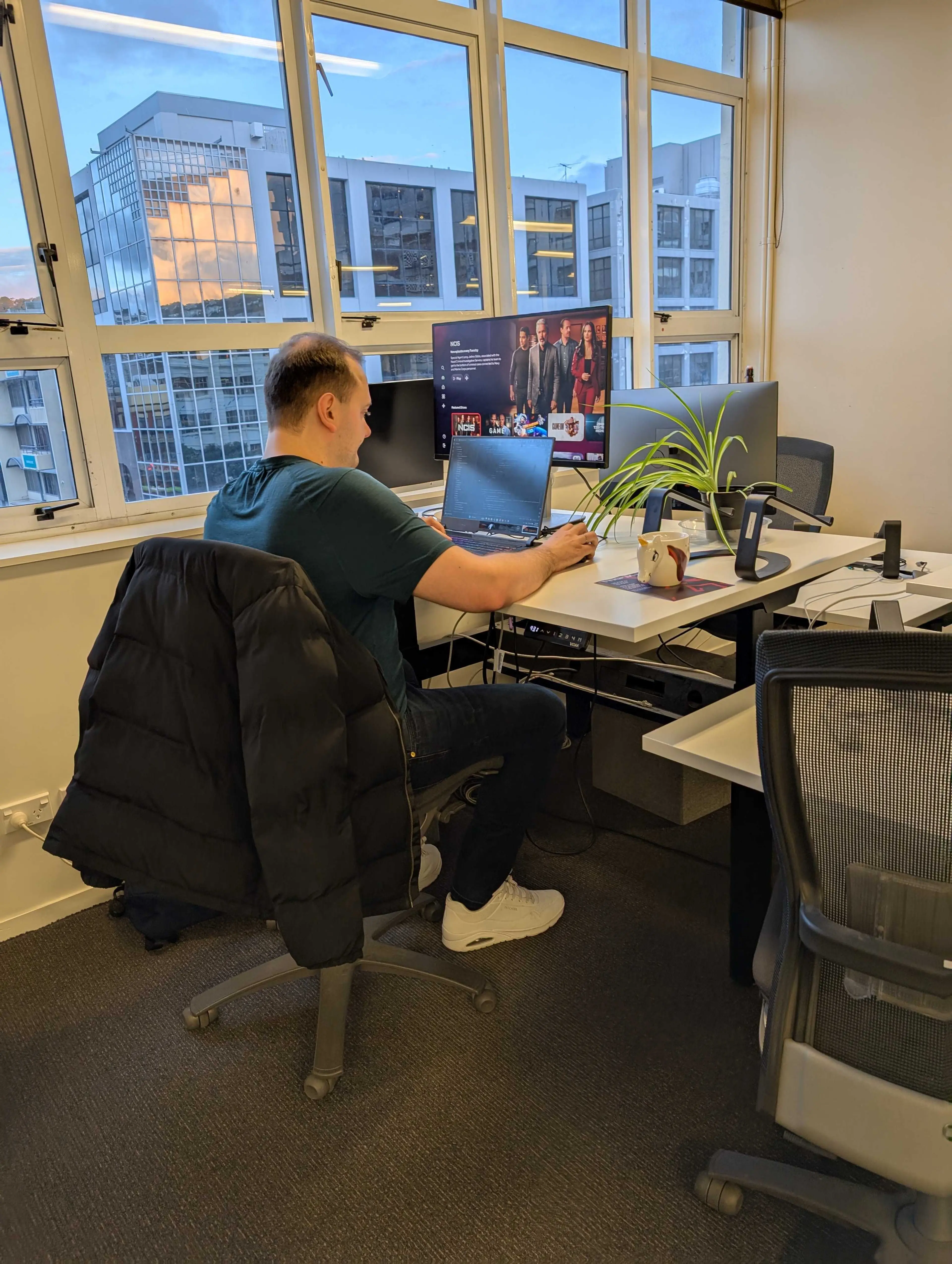 Artiom coding at his desk