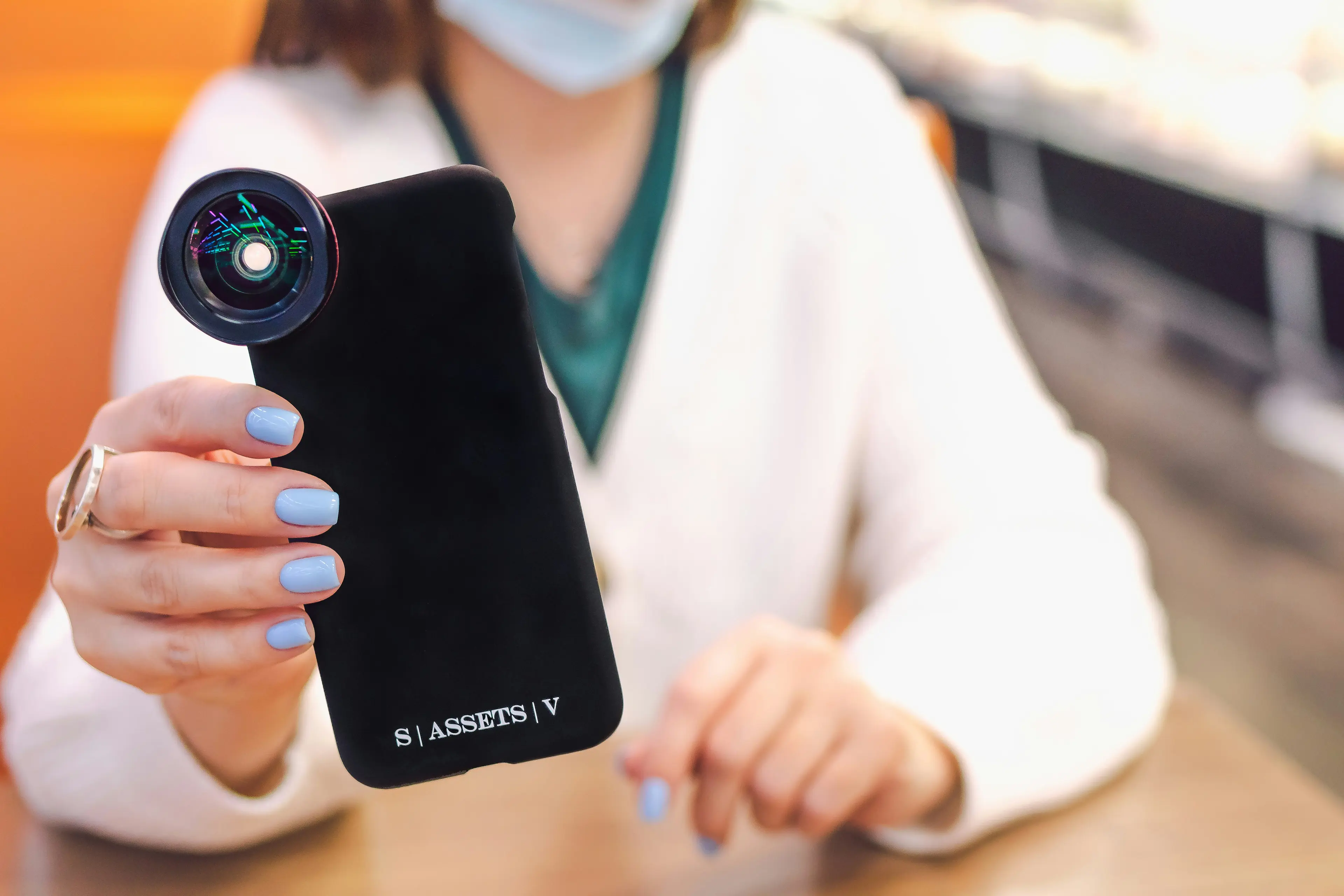 Doctor using an Android moblle phone. Photo by Artem Beliaikin on Unsplash