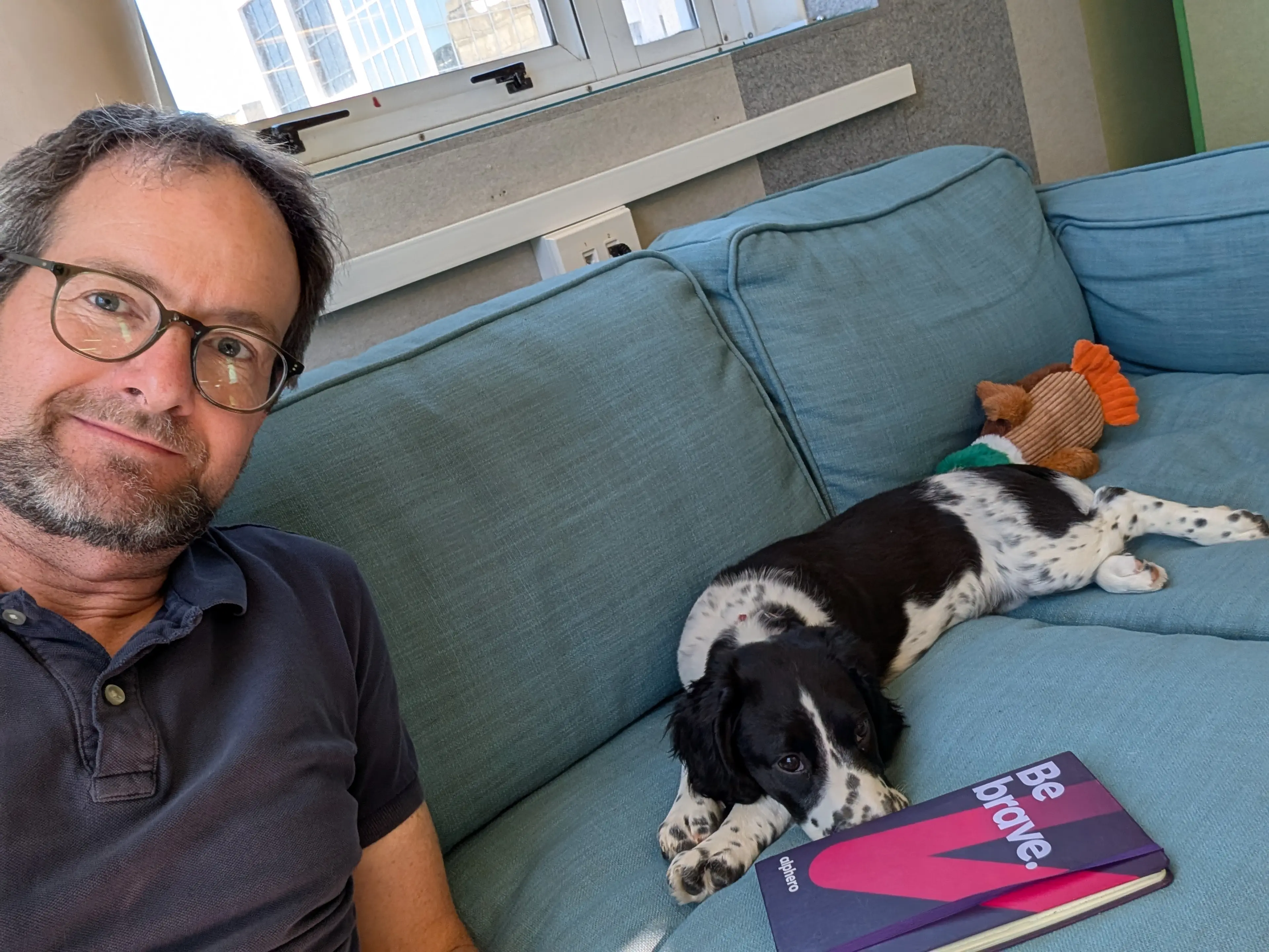 Man on the sofa with his puppy