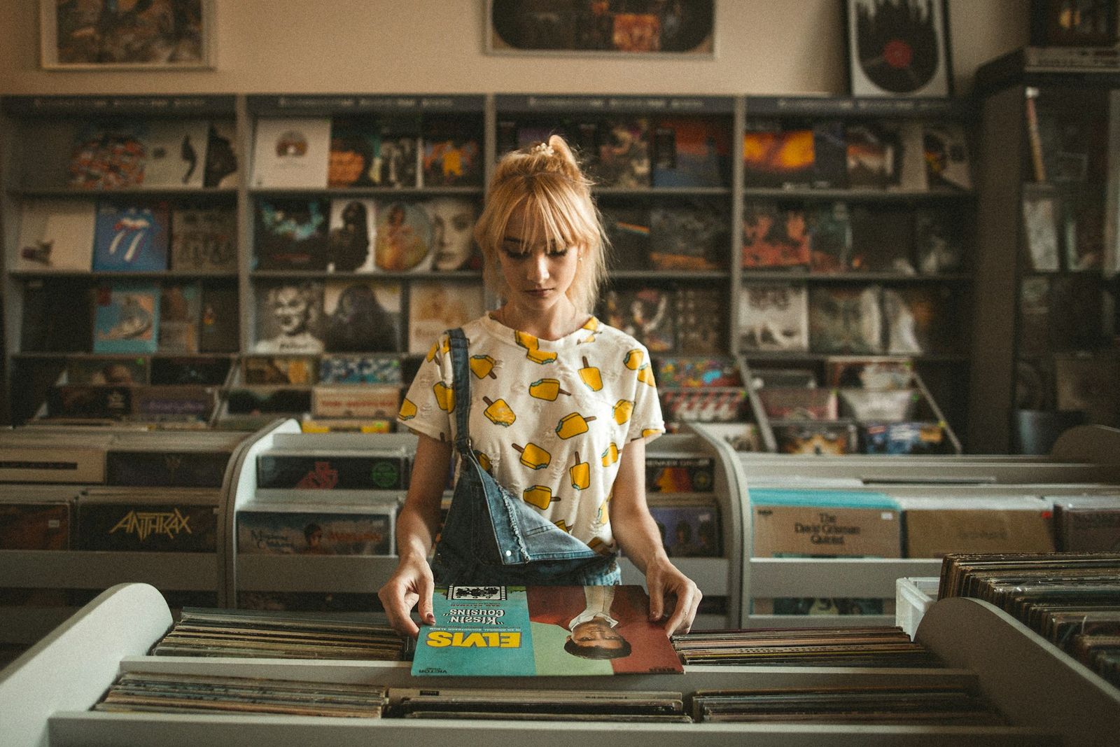 woman holding a vinyl record