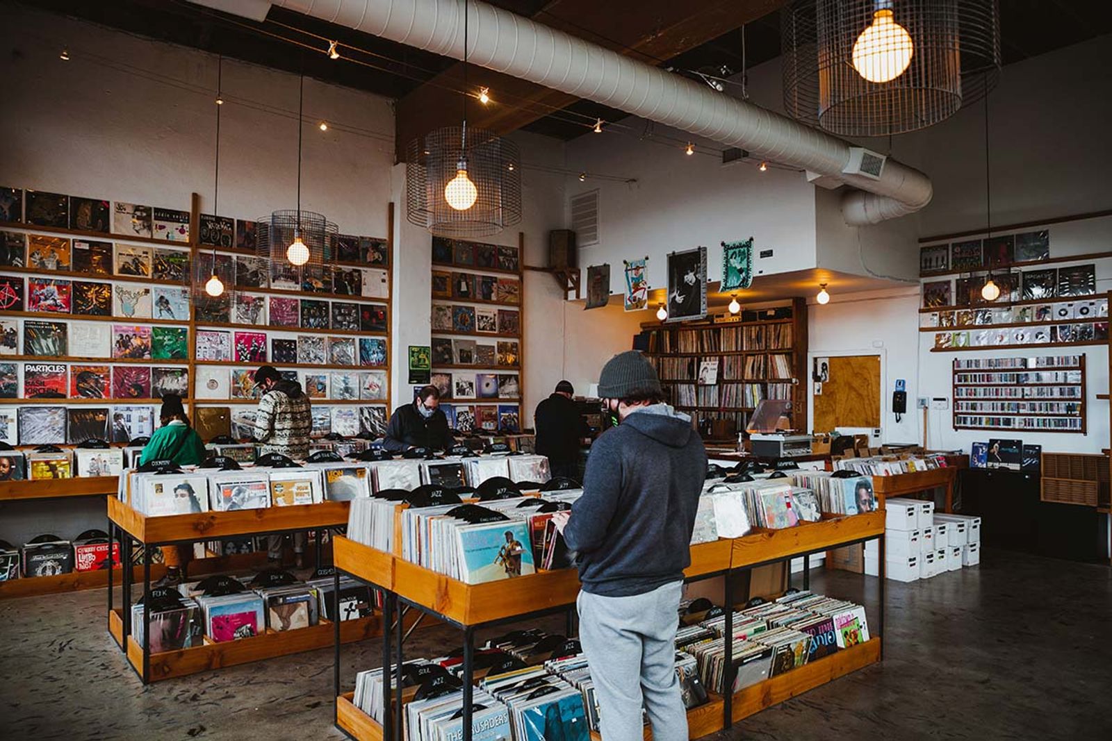 people shopping at a record store