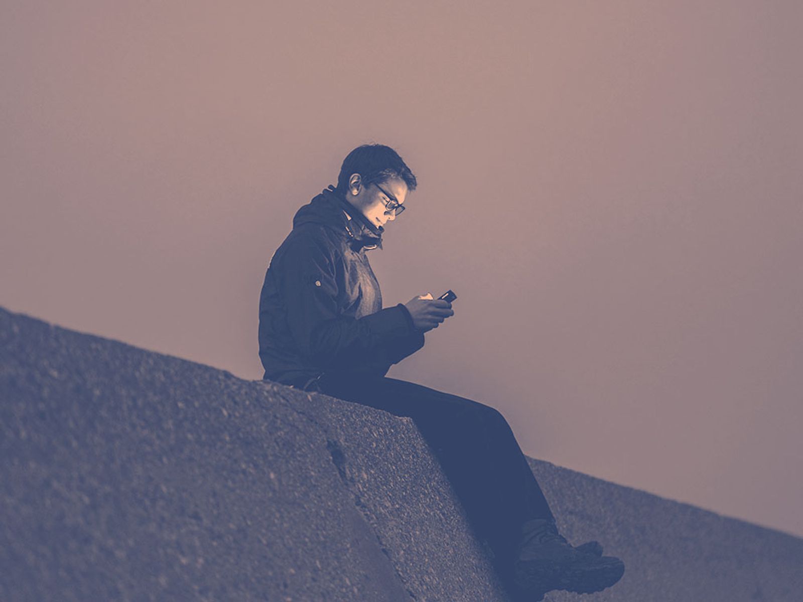 man with phone for pre-saves