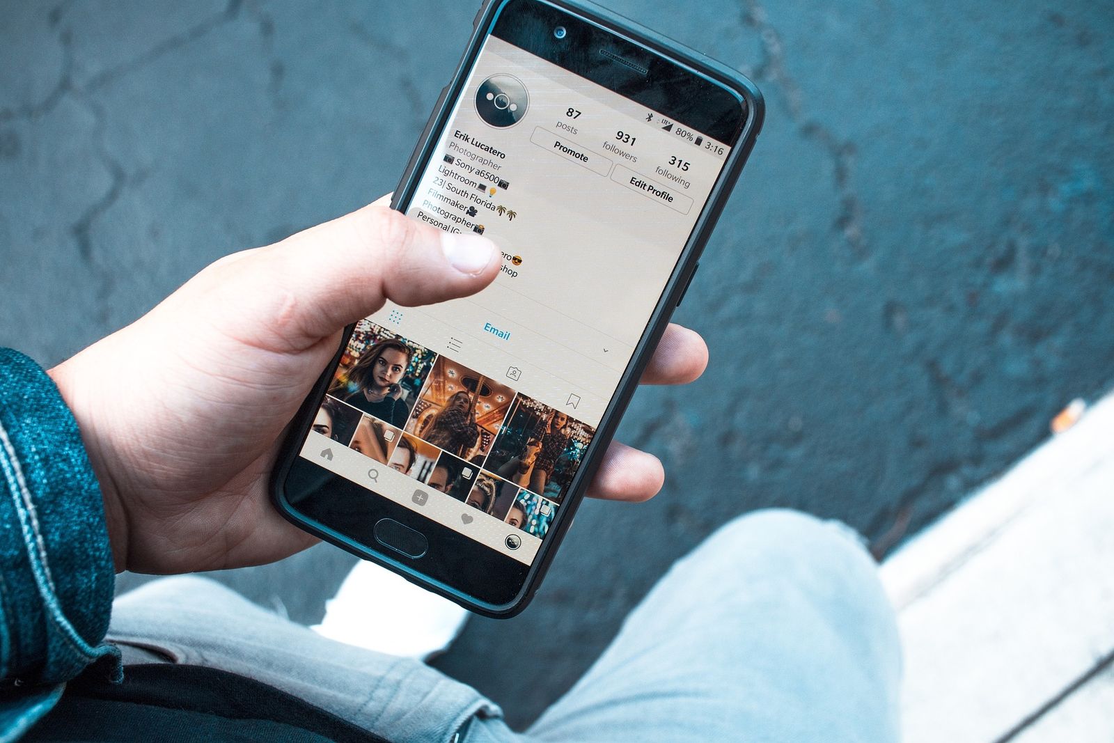 person holding phone with instagram