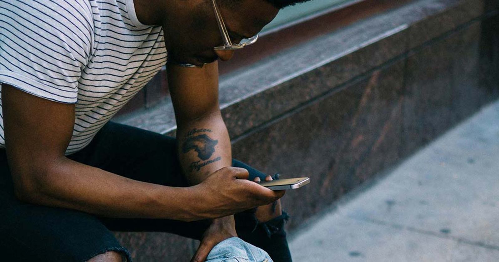 man with phone for more streams with sms marketing