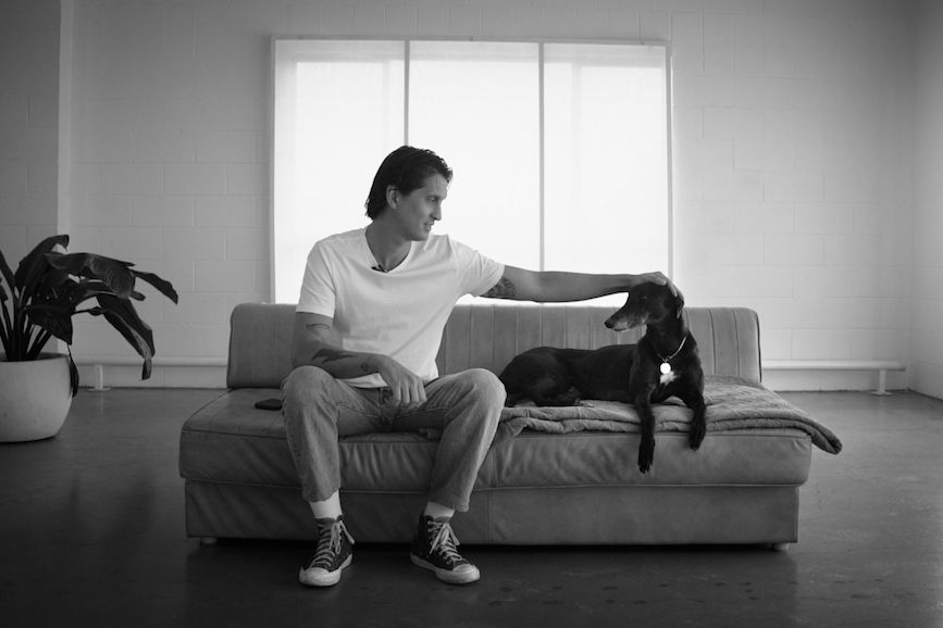 Indy sitting on the couch with Georgie